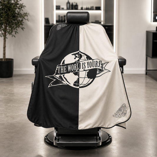 83. The World Is Yours Barber Cape – Black & Cream