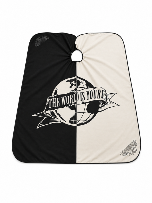 83. The World Is Yours Barber Cape – Black & Cream